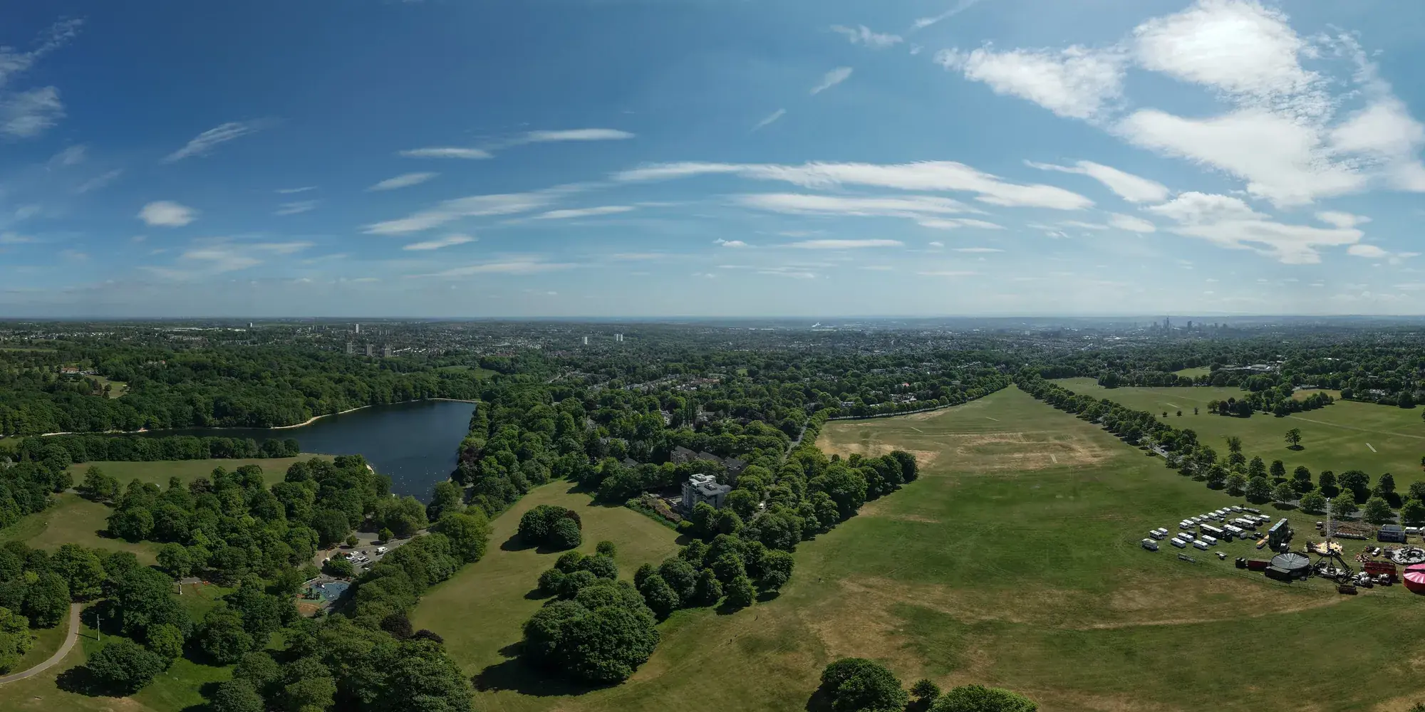 Aerial panorama over Roundhay Park and Waterloo Lake towards the Leeds skyline