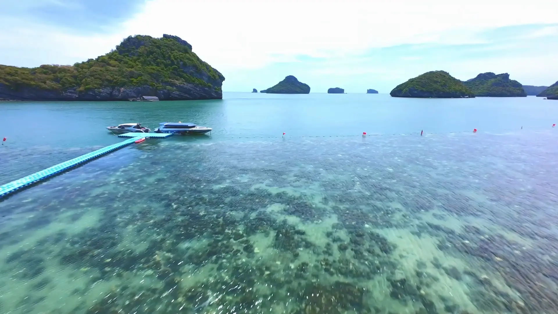 Still from the Ang Thong FPV film: speedboat jetty and islands